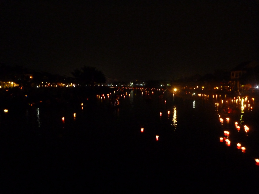hundreds of lanterns floating down the river